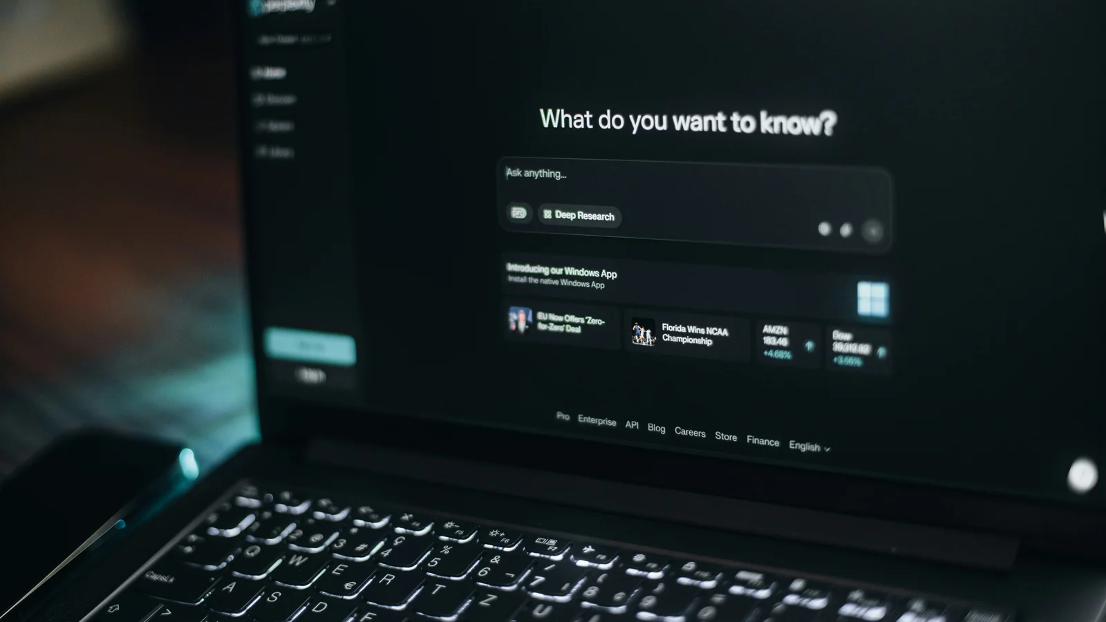 AI search interface open on a laptop asking what the user wants to know