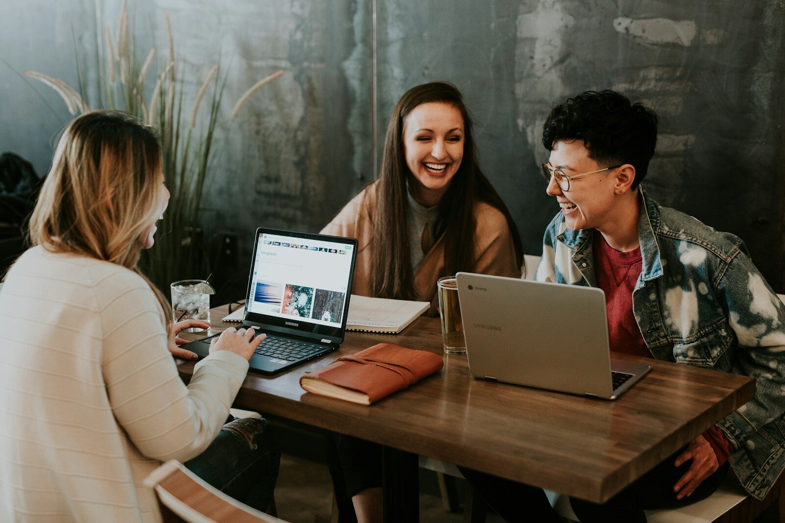 Small business owner reviewing their current website on a laptop