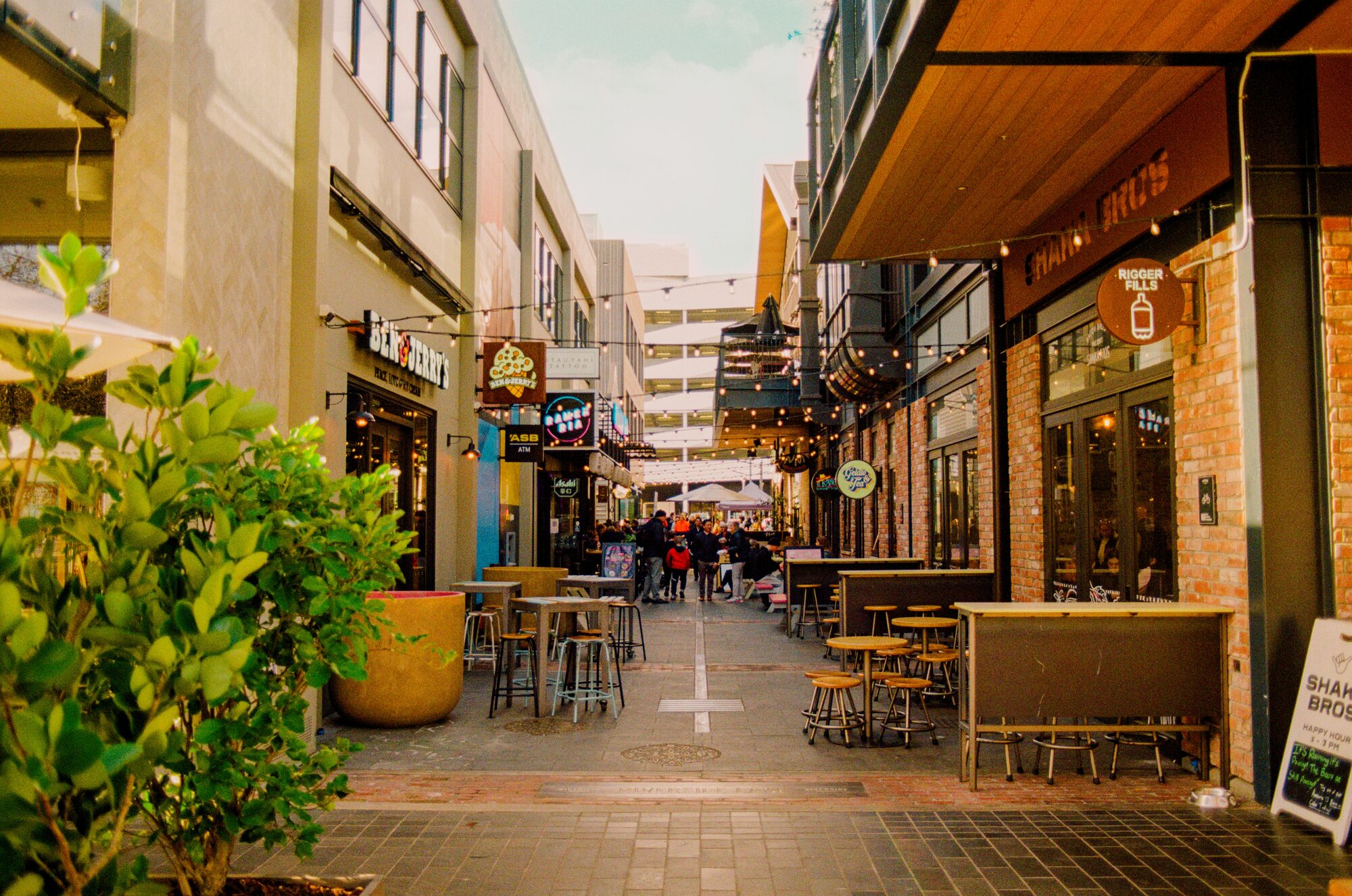 Local New Zealand businesses in a busy shopping laneway, reflecting Fairweb's website design support for small businesses